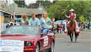 Fair Ambassadors in convertible waving