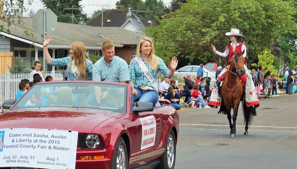 Fair Ambassadors in convertible waving