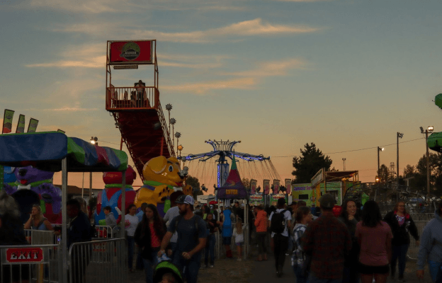 Carnival full of people at dusk