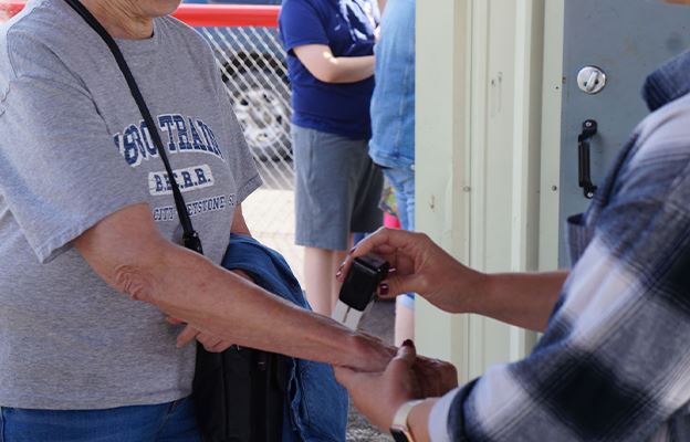 Hand getting stamped at fair